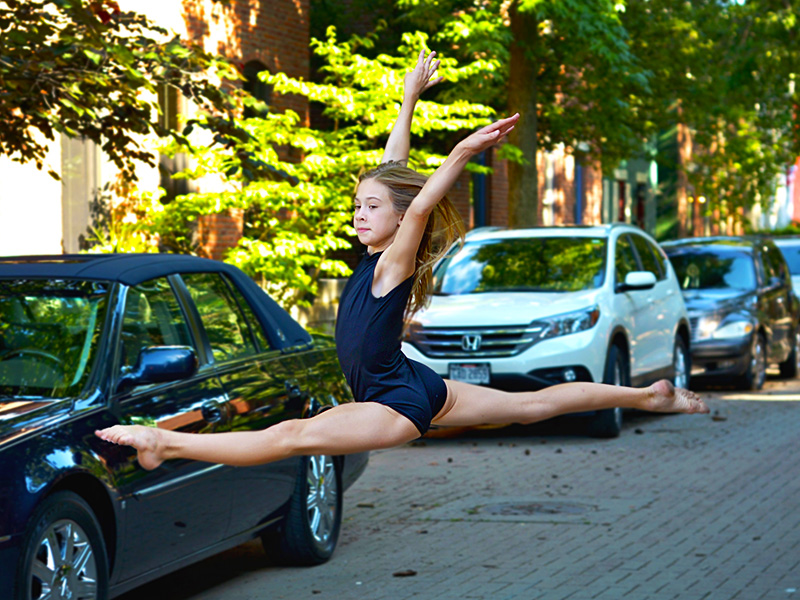 dayton dance conservatory young ballerina jumping in street